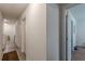Bright hallway with doors leading to different rooms and vinyl plank flooring at 446 Vandenburg Dr, Villa Rica, GA 30180