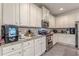 Bright kitchen featuring ample white cabinetry, granite counters, and stainless steel appliances at 446 Vandenburg Dr, Villa Rica, GA 30180