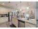 A kitchen featuring stainless steel appliances, granite countertops, and a view of the dining area at 446 Vandenburg Dr, Villa Rica, GA 30180