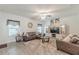 Comfortable living room with plush rug, leather sofas, and entertainment center at 446 Vandenburg Dr, Villa Rica, GA 30180