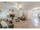 Open-concept living room with staircase, plush rug, and open access to the foyer and bedrooms at 446 Vandenburg Dr, Villa Rica, GA 30180