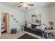 Cozy living room with dark sofa, plush carpet, and adjacent bathroom at 446 Vandenburg Dr, Villa Rica, GA 30180