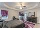 Elegant main bedroom featuring a trey ceiling, fan, stylish decor, and generous space at 446 Vandenburg Dr, Villa Rica, GA 30180