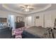 Spacious main bedroom offering a trey ceiling, ample natural light, and elegant furnishings at 446 Vandenburg Dr, Villa Rica, GA 30180