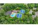 An aerial view of community amenities including a pool, tennis courts and parking at 5507 Martina Way, Dunwoody, GA 30338