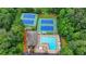 Overhead view of a community pool, tennis courts, and clubhouse at 5507 Martina Way, Dunwoody, GA 30338