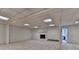 Finished basement with carpet, brick fireplace, and access to additional rooms at 5507 Martina Way, Dunwoody, GA 30338