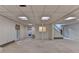 Finished basement with a drop ceiling and access to additional rooms and stairway at 5507 Martina Way, Dunwoody, GA 30338