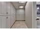 Basement hallway featuring storage cabinets and access to a basement bathroom at 5507 Martina Way, Dunwoody, GA 30338