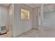 Basement area featuring carpet, painted paneling, and a window to the upper level at 5507 Martina Way, Dunwoody, GA 30338