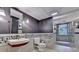 A modern bathroom with a floating sink and a walk-in shower at 5507 Martina Way, Dunwoody, GA 30338