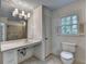 Bright bathroom with natural light, updated vanity, and enclosed shower at 5507 Martina Way, Dunwoody, GA 30338
