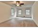 Large bedroom with natural light streaming through windows, offering a cozy and inviting atmosphere at 5507 Martina Way, Dunwoody, GA 30338