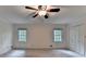 Bright bedroom featuring two windows and a closet, providing ample natural light and storage space at 5507 Martina Way, Dunwoody, GA 30338