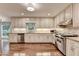 Bright spacious kitchen with hardwood floors, stainless appliances and lots of cabinets at 5507 Martina Way, Dunwoody, GA 30338