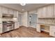 Bright kitchen with stainless steel appliances and adjacent workstation at 5507 Martina Way, Dunwoody, GA 30338