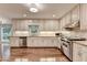 Well-equipped kitchen with stainless steel appliances, granite countertops, and ample cabinet space at 5507 Martina Way, Dunwoody, GA 30338