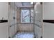 Walk-in shower featuring a stone floor and accents at 5507 Martina Way, Dunwoody, GA 30338
