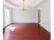 Elegant dining room with hardwood floors, wainscoting, and a chandelier for intimate gatherings at 780 Karingway Nw Ln, Kennesaw, GA 30152