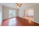 The formal dining room has a modern chandelier, hardwood floors, and wainscotting at 780 Karingway Nw Ln, Kennesaw, GA 30152