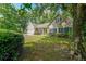 Charming home boasts lush landscaping, a well-manicured lawn, and a welcoming facade at 780 Karingway Nw Ln, Kennesaw, GA 30152