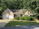 Charming single-Gathering home with a lush lawn, mature trees, and a two-car garage at 780 Karingway Nw Ln, Kennesaw, GA 30152