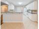 Open kitchen design with a breakfast bar, white cabinets, and granite countertops at 780 Karingway Nw Ln, Kennesaw, GA 30152