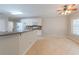 Eat-in kitchen area with tile floors, white cabinets and stone countertops at 780 Karingway Nw Ln, Kennesaw, GA 30152