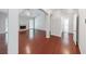 Spacious living room with hardwood floors, fireplace, large window, and an open floor plan at 780 Karingway Nw Ln, Kennesaw, GA 30152