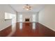 Bright living room with hardwood floors, a fireplace and a ceiling fan at 780 Karingway Nw Ln, Kennesaw, GA 30152