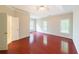 A spacious main bedroom with a ceiling fan, plush carpets, and lots of natural light at 780 Karingway Nw Ln, Kennesaw, GA 30152