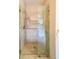 Modern walk-in shower features a glass door, beautiful tile, and updated shower fixtures at 780 Karingway Nw Ln, Kennesaw, GA 30152