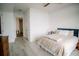 Bright bedroom with a ceiling fan, wood floors, and an open doorway to the hallway and bath at 270 17Th Nw St # 3804, Atlanta, GA 30363