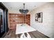 Stylish dining area with unique wine rack, chandelier, and modern wall art at 270 17Th Nw St # 3804, Atlanta, GA 30363