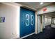 Hallway with unit number 38 and directional signage for multiple units at 270 17Th Nw St # 3804, Atlanta, GA 30363