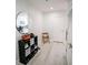 Hallway featuring wooden floors, organizational shelving, and a decorative mirror at 270 17Th Nw St # 3804, Atlanta, GA 30363