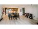 Open-concept kitchen and dining area with an island, modern lighting, and hardwood floors at 270 17Th Nw St # 3804, Atlanta, GA 30363