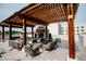 Beautiful outdoor space with fireplace, comfortable seating, shade from pergola and lush plants at 270 17Th Nw St # 3804, Atlanta, GA 30363