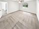 Bright bedroom with neutral carpet, natural light, and an open doorway to another room at 2734 Amber Springs Way, Buford, GA 30519