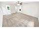 Well-lit bedroom offering neutral carpet and access to both a bathroom and an adjacent room at 2734 Amber Springs Way, Buford, GA 30519
