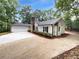 Beautiful home boasting a manicured lawn, stone chimney, and an attached garage at 2734 Amber Springs Way, Buford, GA 30519