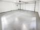 Spacious two car garage with epoxy flooring and plenty of storage space at 2734 Amber Springs Way, Buford, GA 30519
