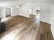 Open concept living room featuring luxury vinyl plank flooring and plenty of natural light at 2734 Amber Springs Way, Buford, GA 30519