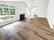 Spacious living room featuring vaulted ceiling, fireplace, and plentiful natural light at 2734 Amber Springs Way, Buford, GA 30519