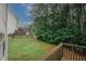 A view from a wood deck showing a wooded backyard and partial views of the house at 365 Hunt Creek Dr, Acworth, GA 30101
