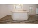 An eye-level view of the light colored bar with a white base and granite top at 365 Hunt Creek Dr, Acworth, GA 30101