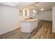 Light bright room featuring a granite-topped bar with white base cabinets at 365 Hunt Creek Dr, Acworth, GA 30101