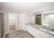Bathroom features a double vanity, granite countertop, walk-in shower, and wood-style tile flooring at 365 Hunt Creek Dr, Acworth, GA 30101