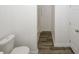 Half bathroom with a toilet and wooden-look tile floors at 365 Hunt Creek Dr, Acworth, GA 30101
