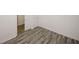 Neutral-colored bedroom with wood-look flooring and access to other rooms at 365 Hunt Creek Dr, Acworth, GA 30101